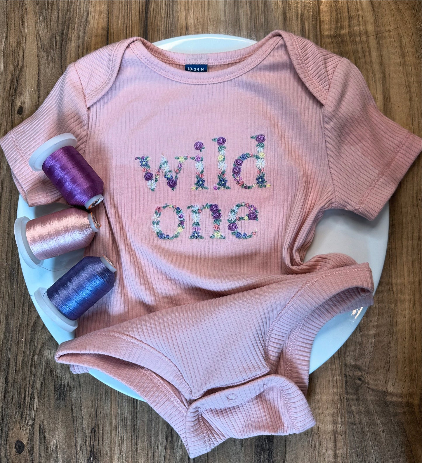 Embroidered baby onesie